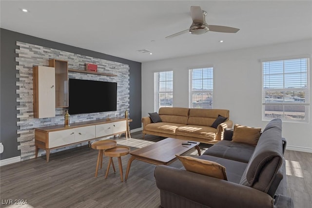 living room with ceiling fan and dark hardwood / wood-style floors