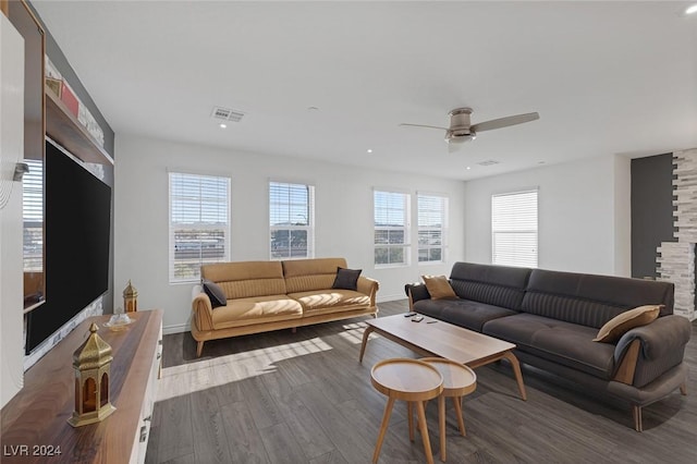 living room featuring dark hardwood / wood-style flooring and ceiling fan