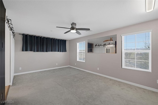 unfurnished room featuring carpet flooring and ceiling fan