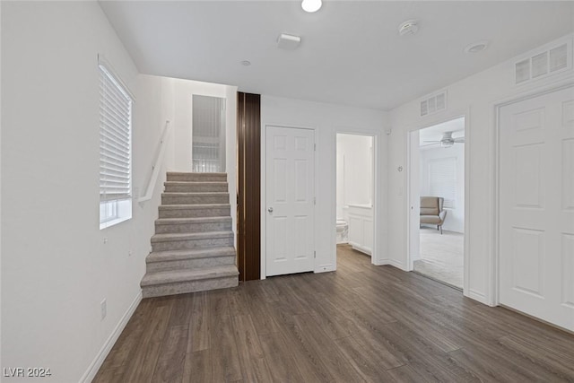 interior space featuring dark hardwood / wood-style floors and ceiling fan