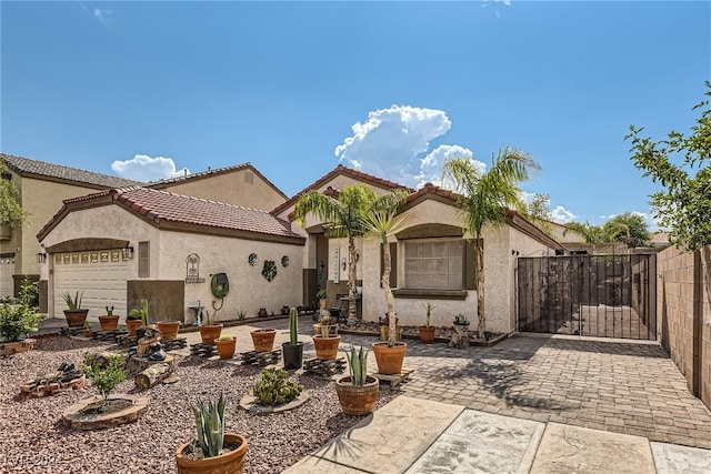 mediterranean / spanish house with a garage