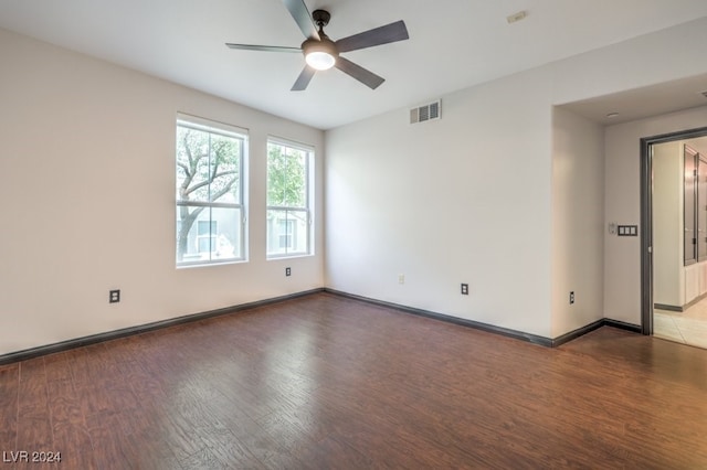 empty room featuring ceiling fan and wood-type flooring