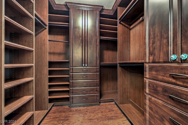 spacious closet featuring hardwood / wood-style flooring