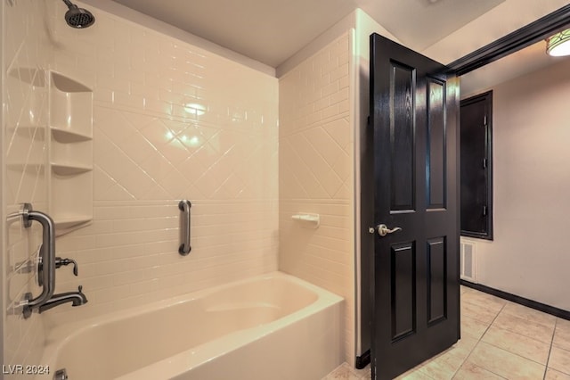 bathroom featuring tile patterned floors and tiled shower / bath