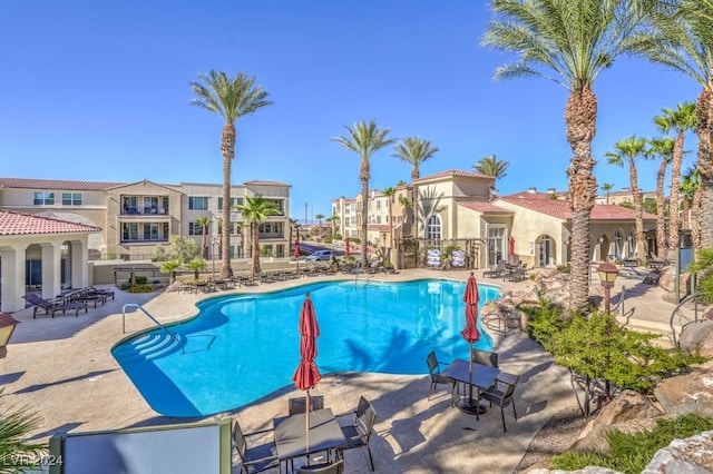 view of swimming pool featuring a patio