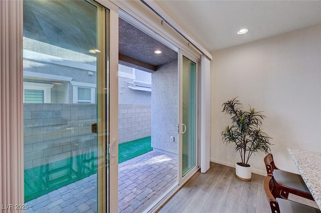 entryway with light hardwood / wood-style flooring