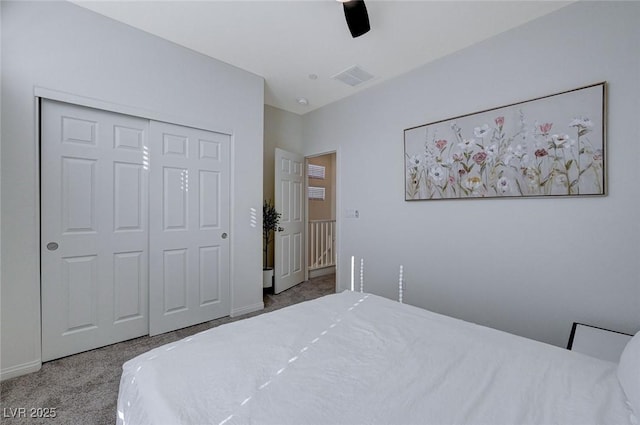 bedroom with carpet, ceiling fan, and a closet