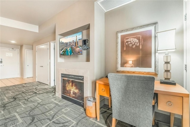 office with carpet and a fireplace