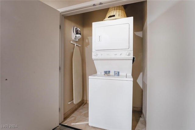 washroom with stacked washer / drying machine