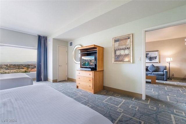 bedroom with dark colored carpet