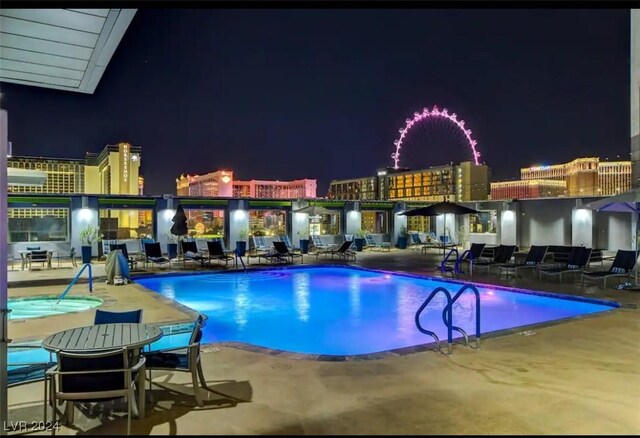 211 E Flamingo Rd Unit 614, Las Vegas, NV 89169 - pool at night with a community pool and a patio
