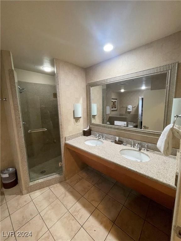 bathroom featuring tile patterned floors, vanity, and walk in shower