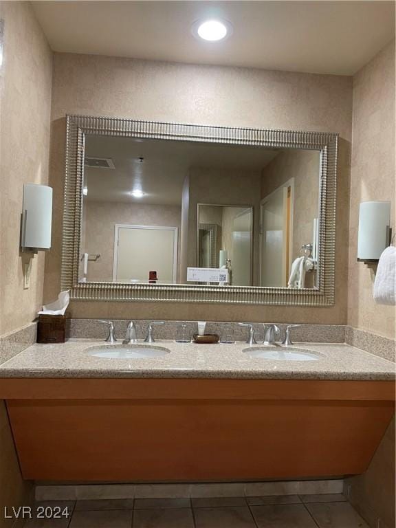 bathroom featuring tile patterned floors and vanity