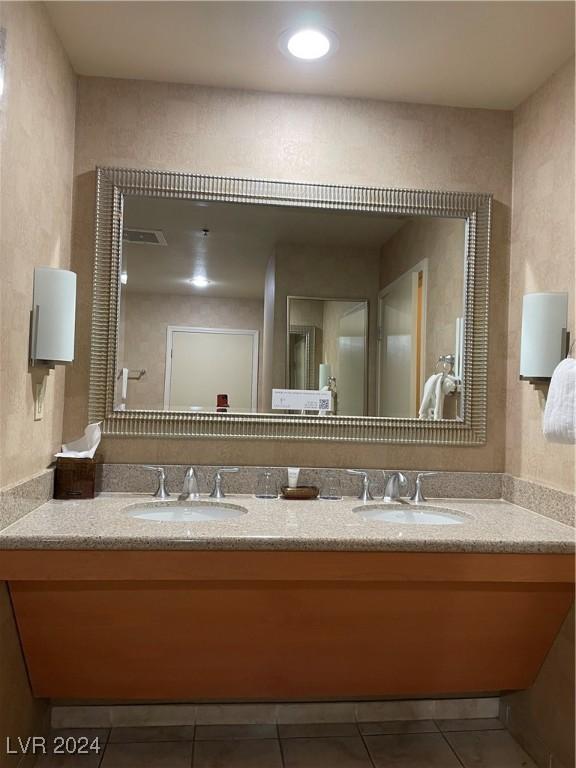 211 E Flamingo Rd Unit 614, Las Vegas, NV 89169 - bathroom with double vanity and tile patterned flooring