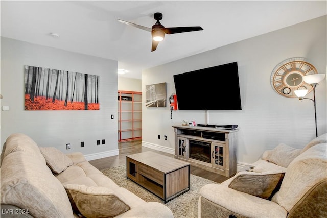 living room with hardwood / wood-style floors and ceiling fan