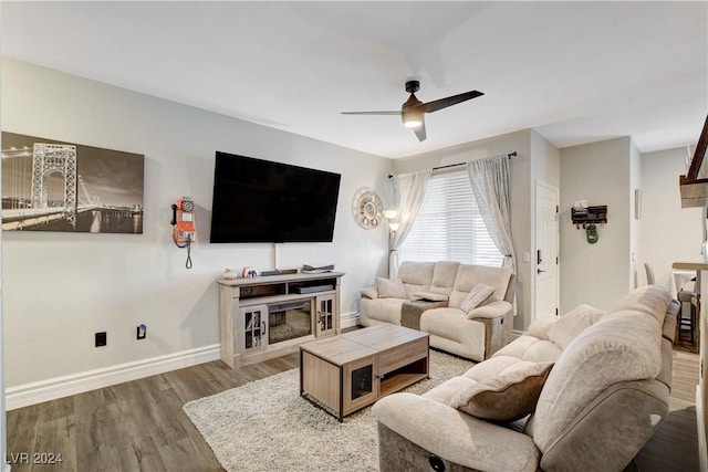 living room with hardwood / wood-style floors and ceiling fan