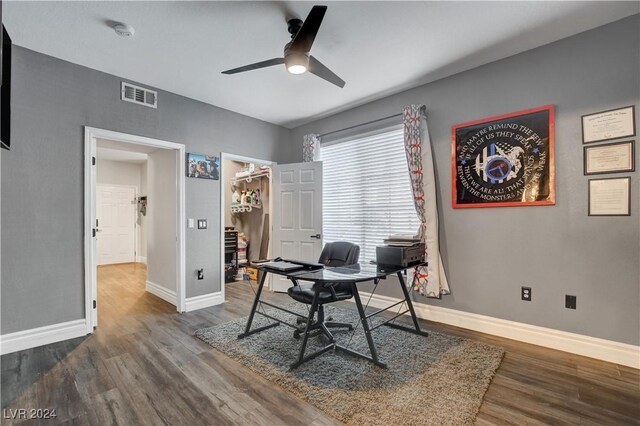 office area featuring dark hardwood / wood-style floors and ceiling fan