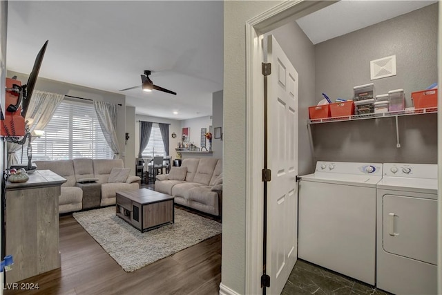 laundry room featuring dark hardwood / wood-style flooring, washing machine and dryer, and ceiling fan