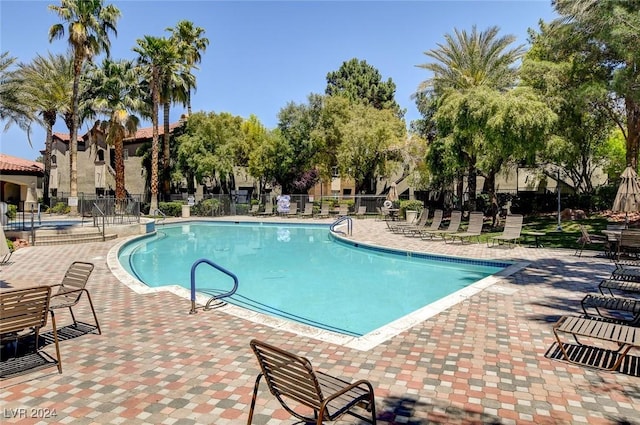 view of swimming pool with a patio area