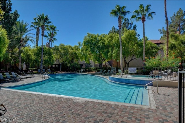 view of swimming pool featuring a patio area