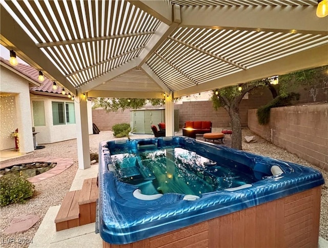 exterior space featuring a hot tub, a storage unit, a fenced backyard, and an outdoor structure