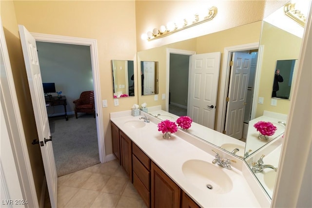 bathroom with tile patterned flooring and vanity