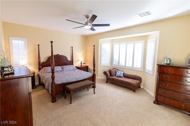 bedroom with light colored carpet and ceiling fan