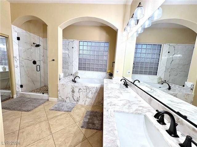 bathroom featuring vanity, tile patterned flooring, and plus walk in shower