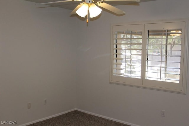 spare room featuring ceiling fan and carpet floors