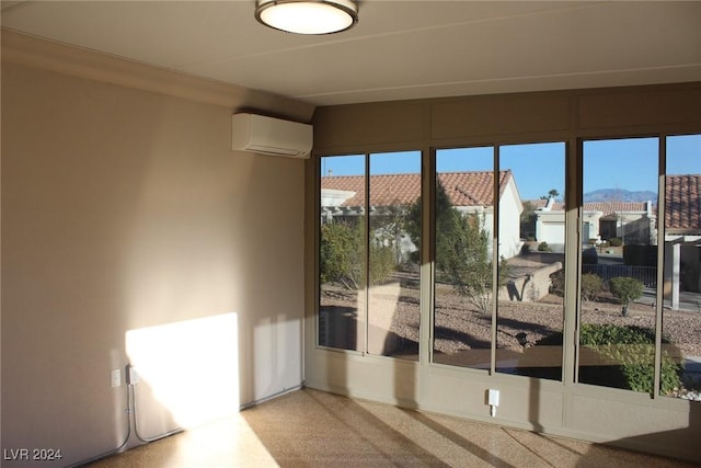 doorway featuring an AC wall unit and crown molding