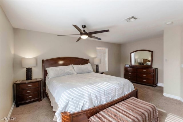 bedroom with light carpet and ceiling fan