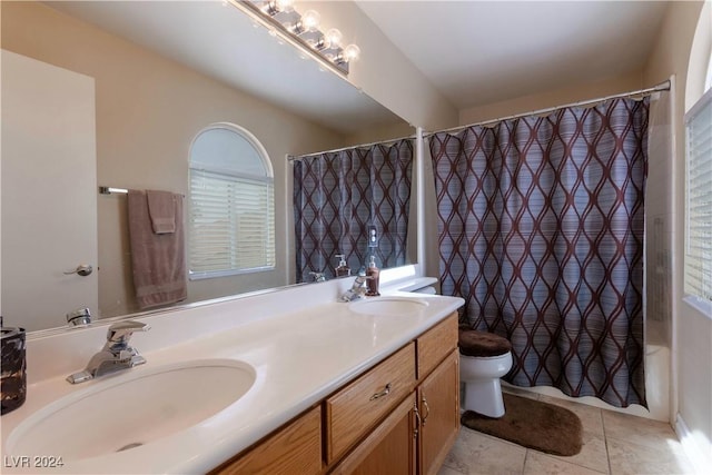 full bathroom with shower / bathtub combination with curtain, tile patterned flooring, vanity, and toilet