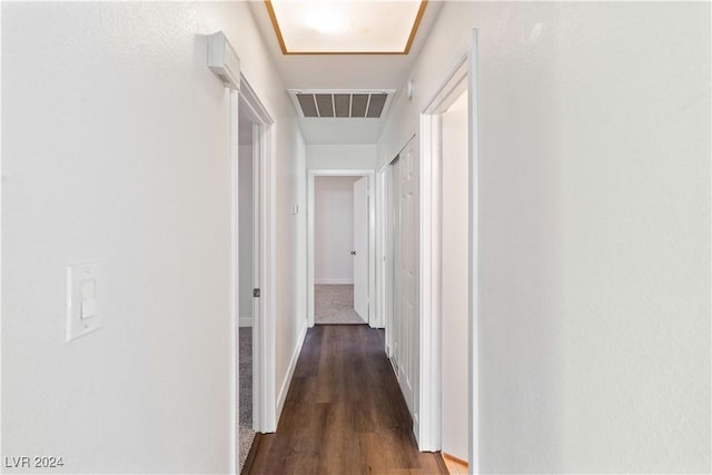 corridor with dark hardwood / wood-style floors