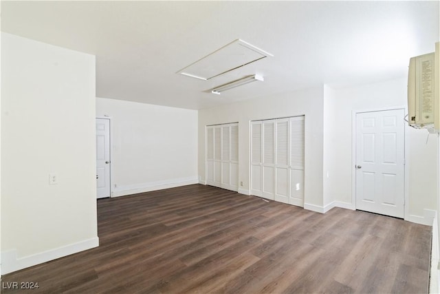 spare room with dark wood-type flooring