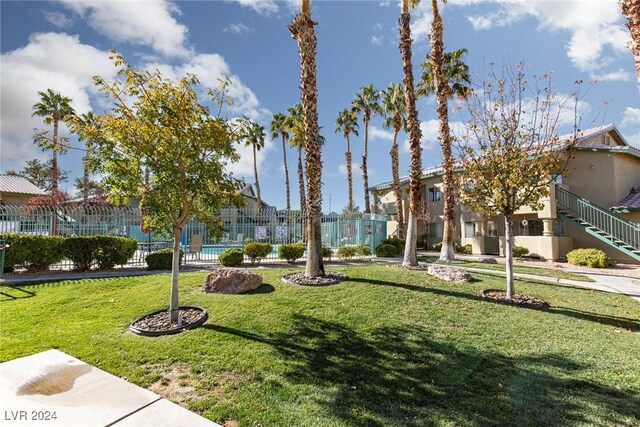 304 S Buffalo Dr Unit 201, Las Vegas, NV 89145 - view of property's community featuring a yard