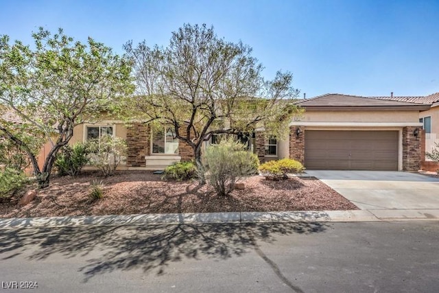 ranch-style home featuring a garage