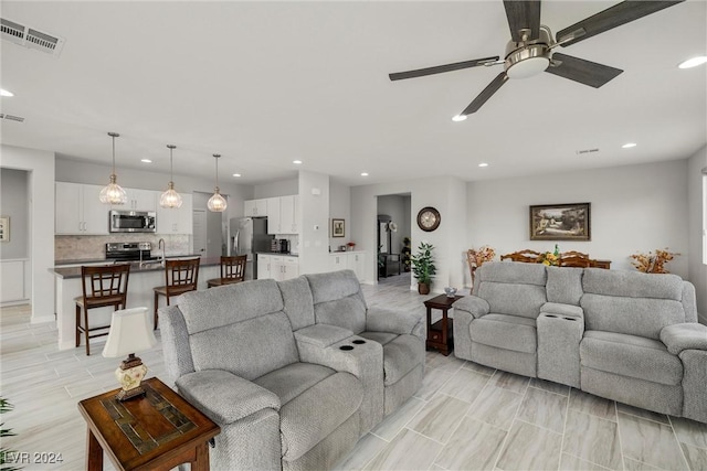 living room featuring ceiling fan