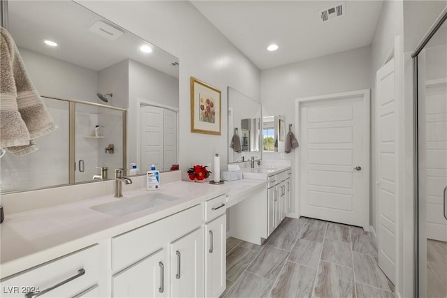 bathroom with vanity and walk in shower