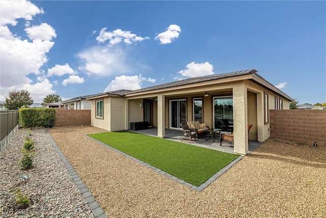 rear view of property with a patio