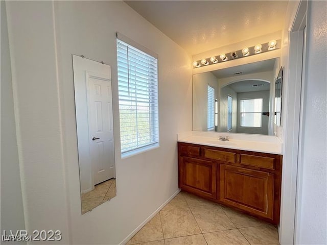 bathroom featuring tile patterned floors and vanity