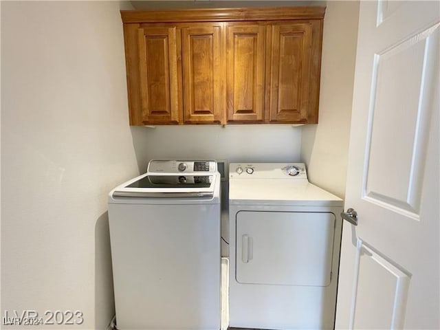 laundry area with cabinets and washer and dryer