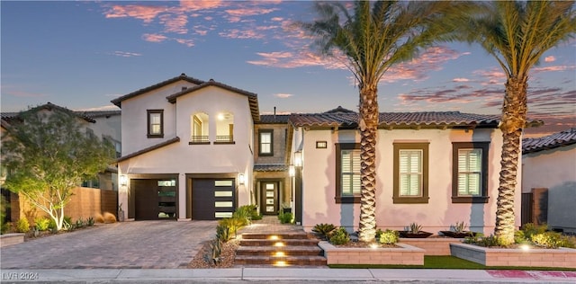 mediterranean / spanish-style house featuring a garage