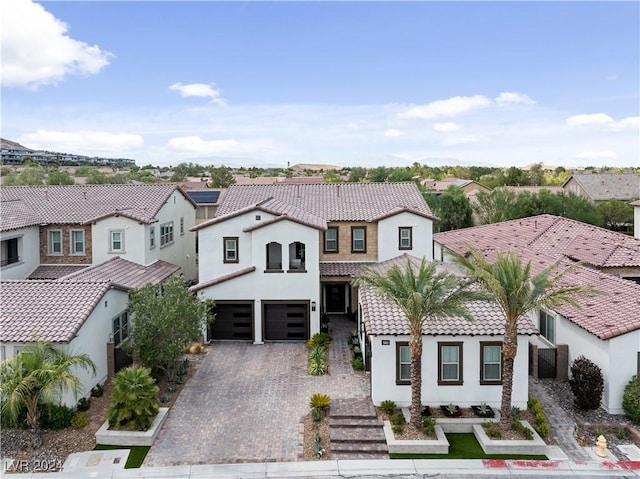 mediterranean / spanish-style home featuring a garage