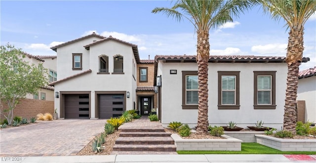 mediterranean / spanish-style house featuring a garage