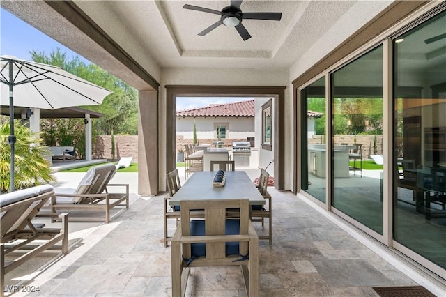 view of patio featuring ceiling fan