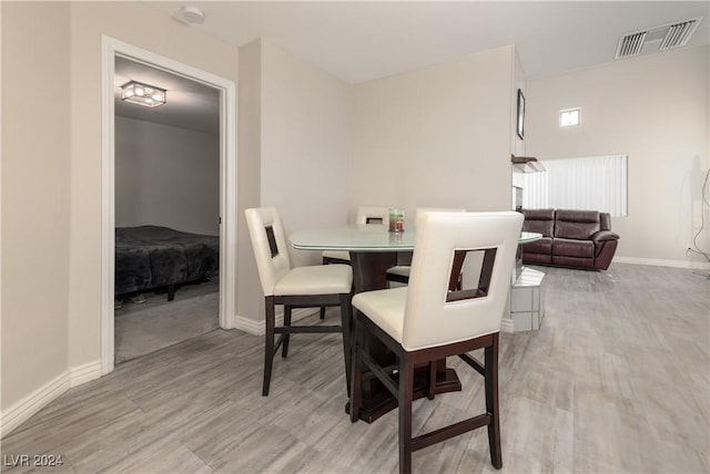 dining space featuring light hardwood / wood-style flooring