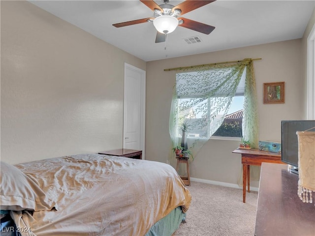 carpeted bedroom featuring ceiling fan