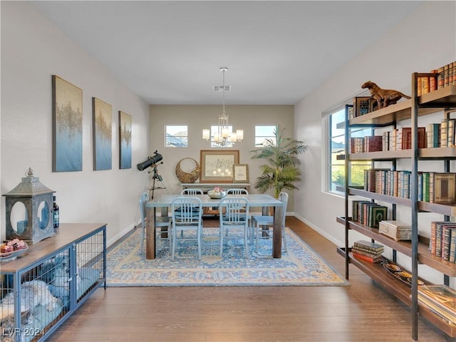 dining room featuring a chandelier and hardwood / wood-style flooring