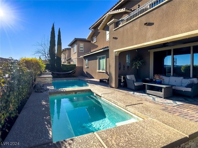 view of swimming pool featuring a patio area, an in ground hot tub, and an outdoor hangout area