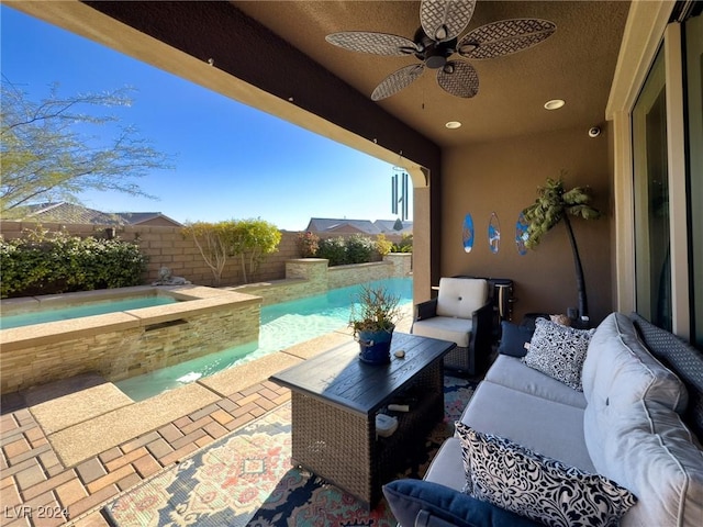 view of patio / terrace featuring an outdoor living space, ceiling fan, and a fenced in pool